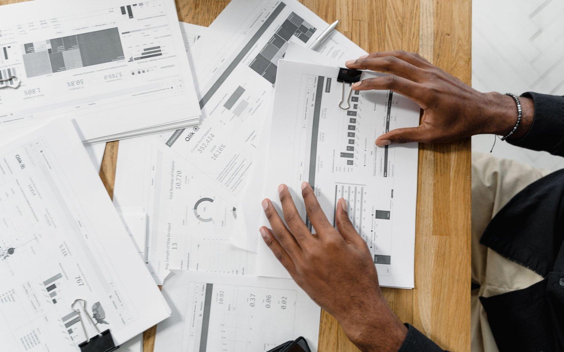Someone reviewing a queue of work on screen at a desk